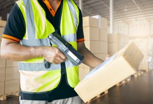 Warehouse worker is working with cargo in warehouse.